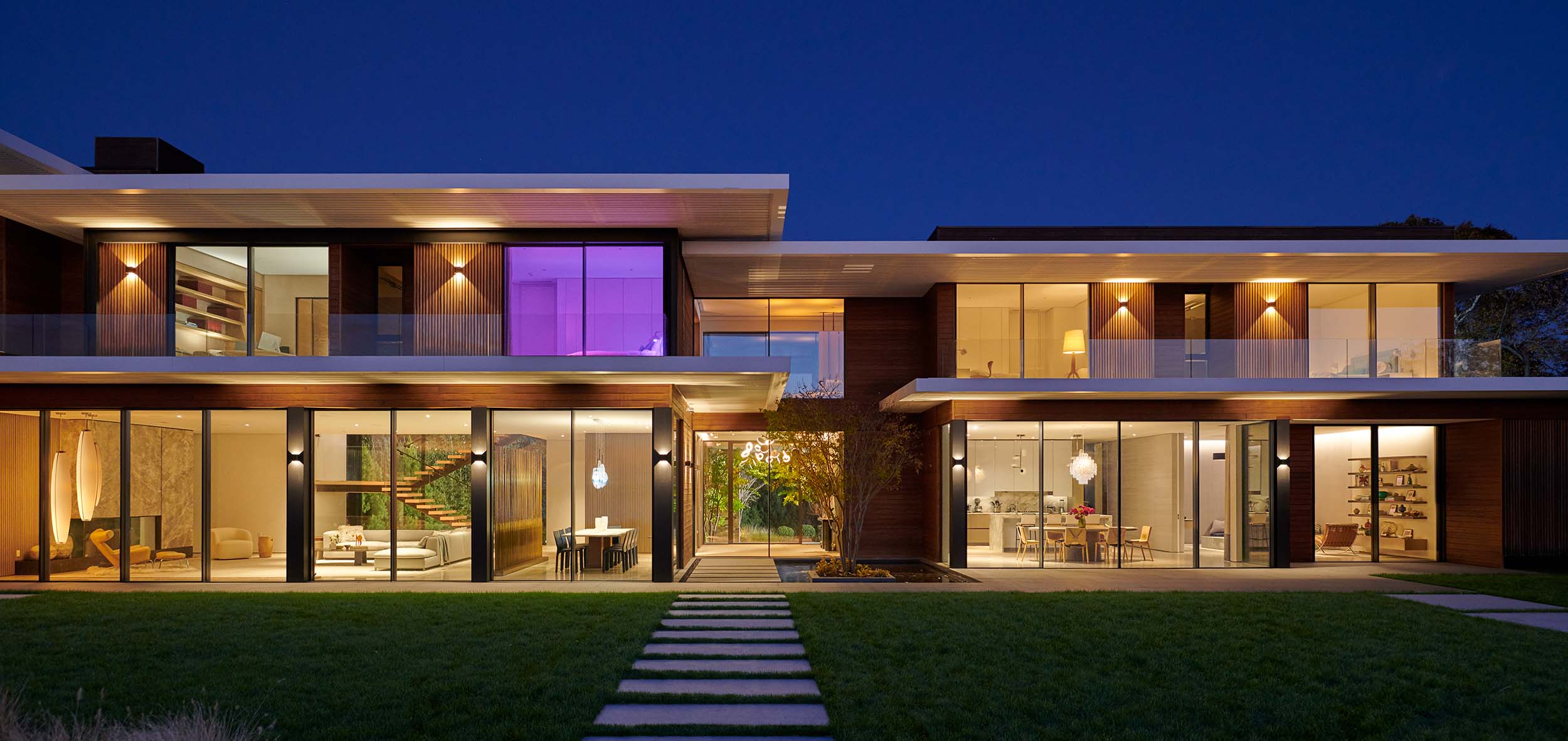 a highly modern home with ketra and lutton lighting at dusk
